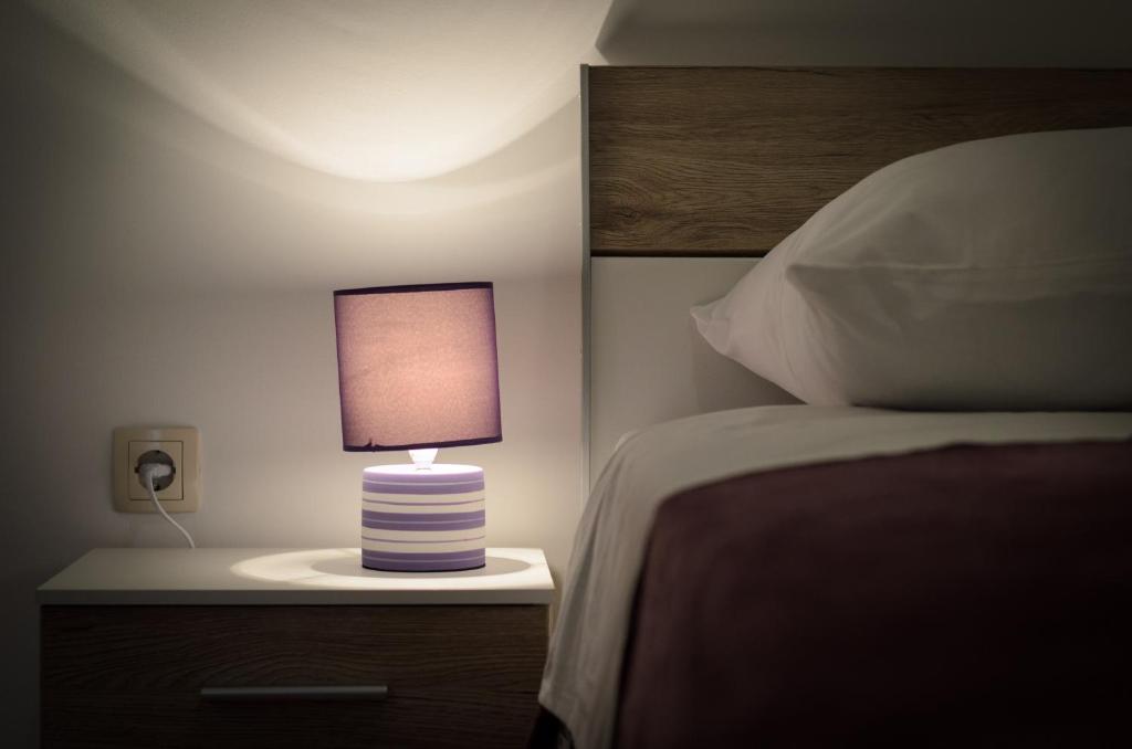 Posteľ alebo postele v izbe v ubytovaní Apartmani Beran