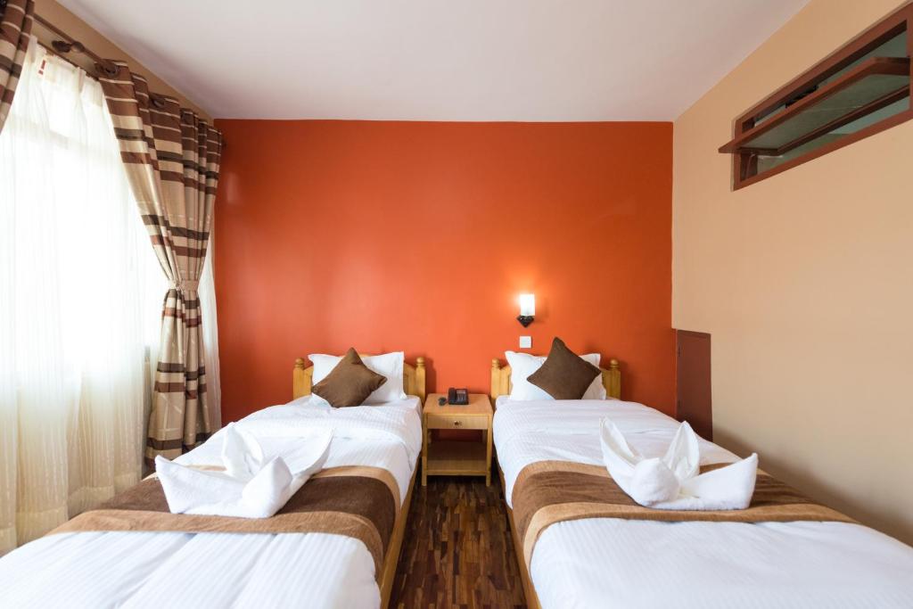 Postel nebo postele na pokoji v ubytování Khangsar Home