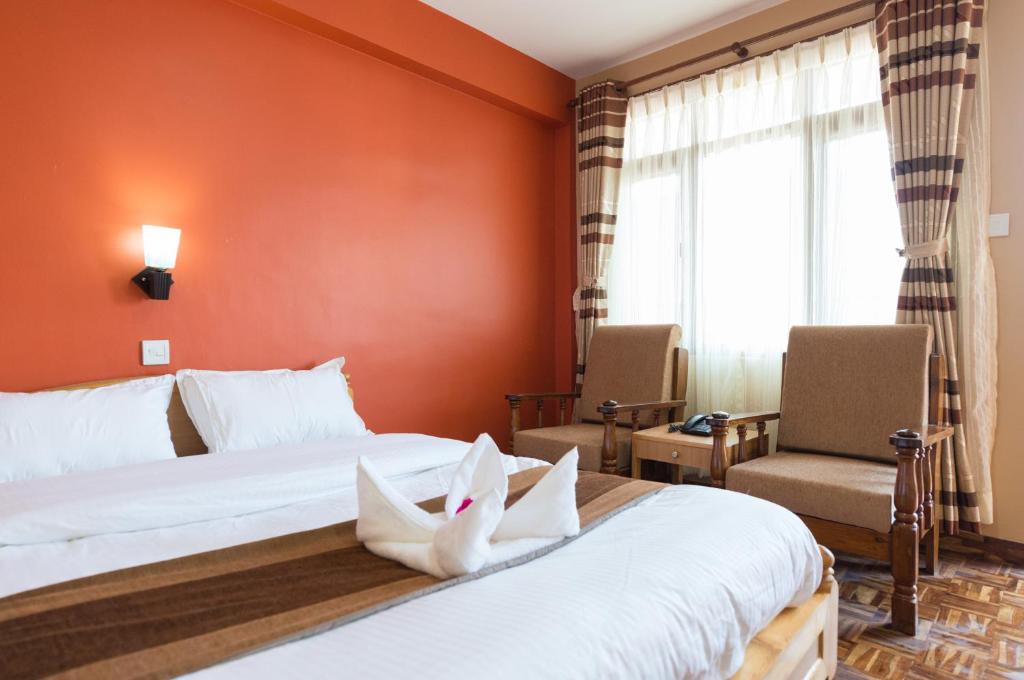 Postel nebo postele na pokoji v ubytování Khangsar Home