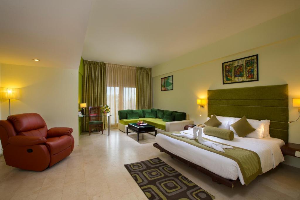 Postel nebo postele na pokoji v ubytování Hotel Atithi