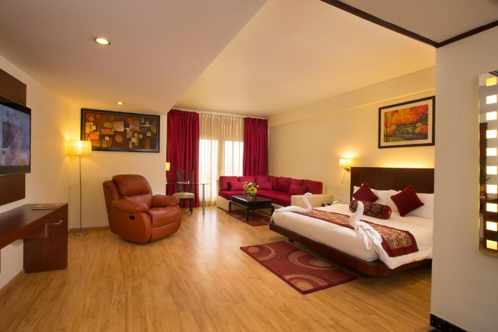 Postel nebo postele na pokoji v ubytování Hotel Atithi