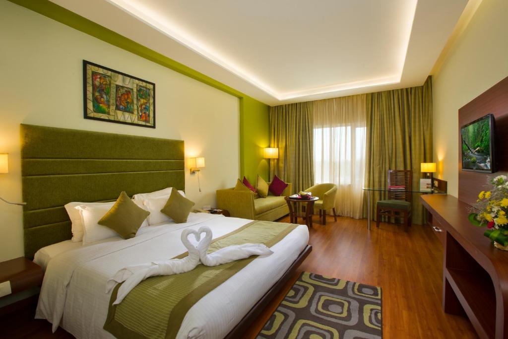 Postel nebo postele na pokoji v ubytování Hotel Atithi