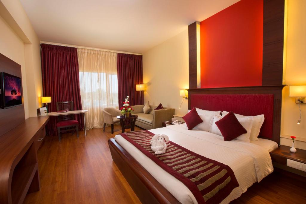 Postel nebo postele na pokoji v ubytování Hotel Atithi