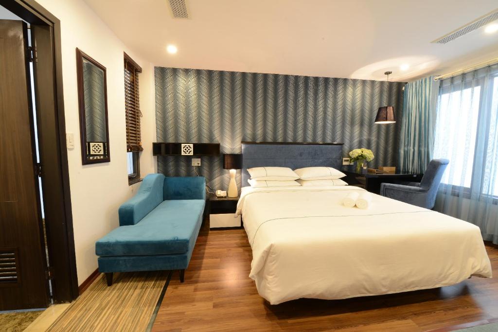 Postel nebo postele na pokoji v ubytování Hanoi Emerald Waters Hotel & Spa