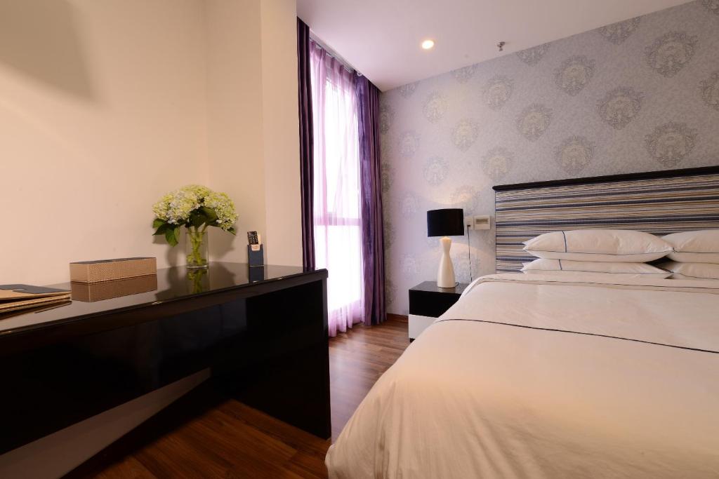 Postel nebo postele na pokoji v ubytování Hanoi Emerald Waters Hotel & Spa