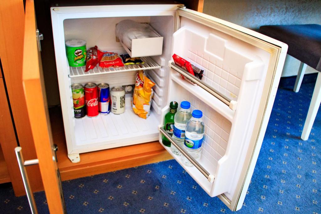 Kuchyň nebo kuchyňský kout v ubytování Burcman Hotel