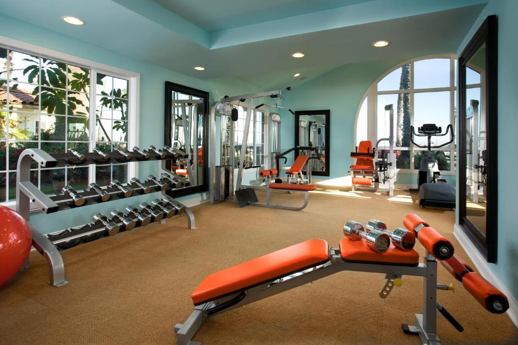 a fitness room with a gym with several tread machines at The Milo in Santa Barbara