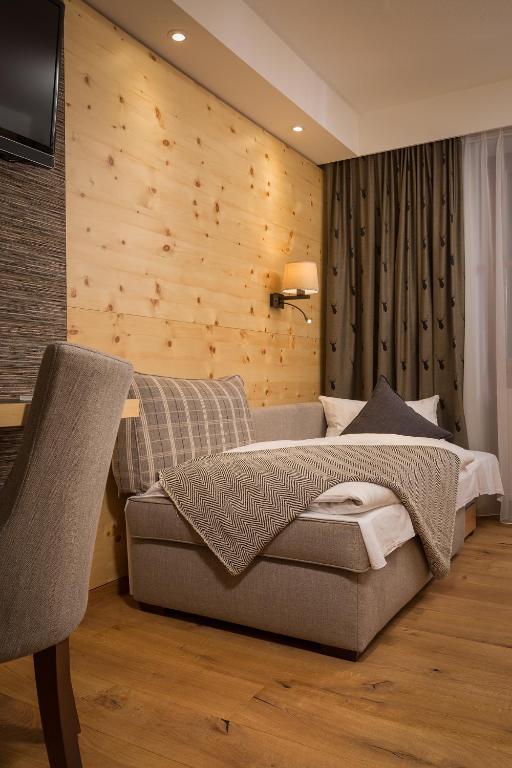 Hotel Weinbauer - Luxuriöses Dreibettzimmer