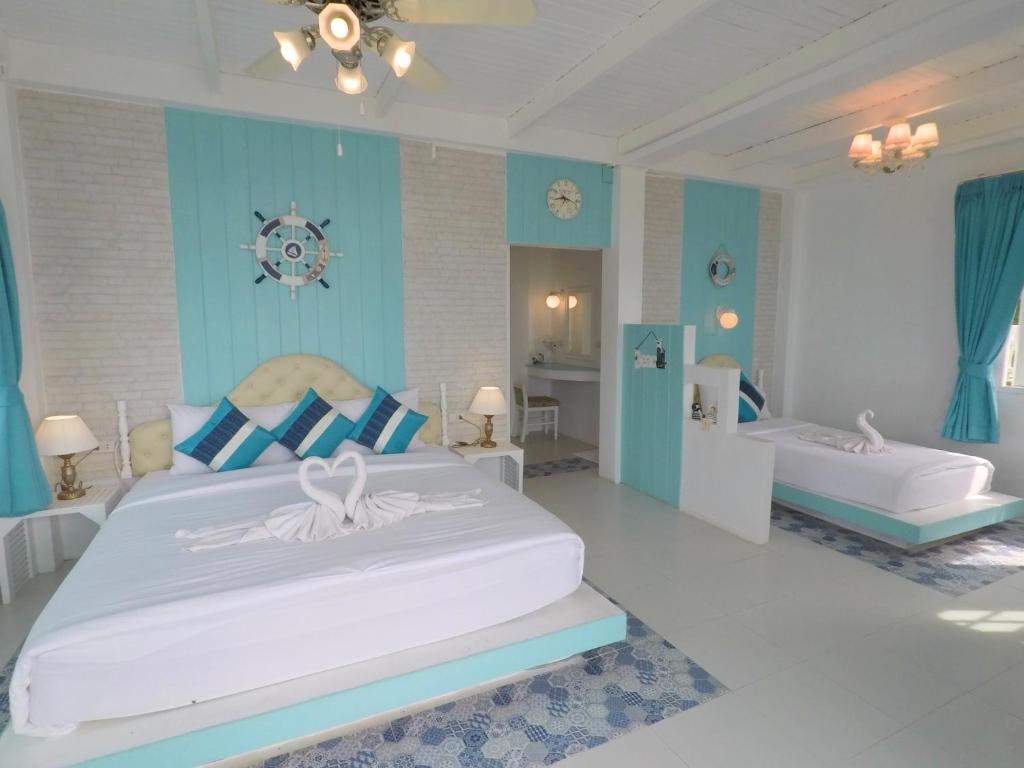 Postel nebo postele na pokoji v ubytování DD Hut Koh Tao