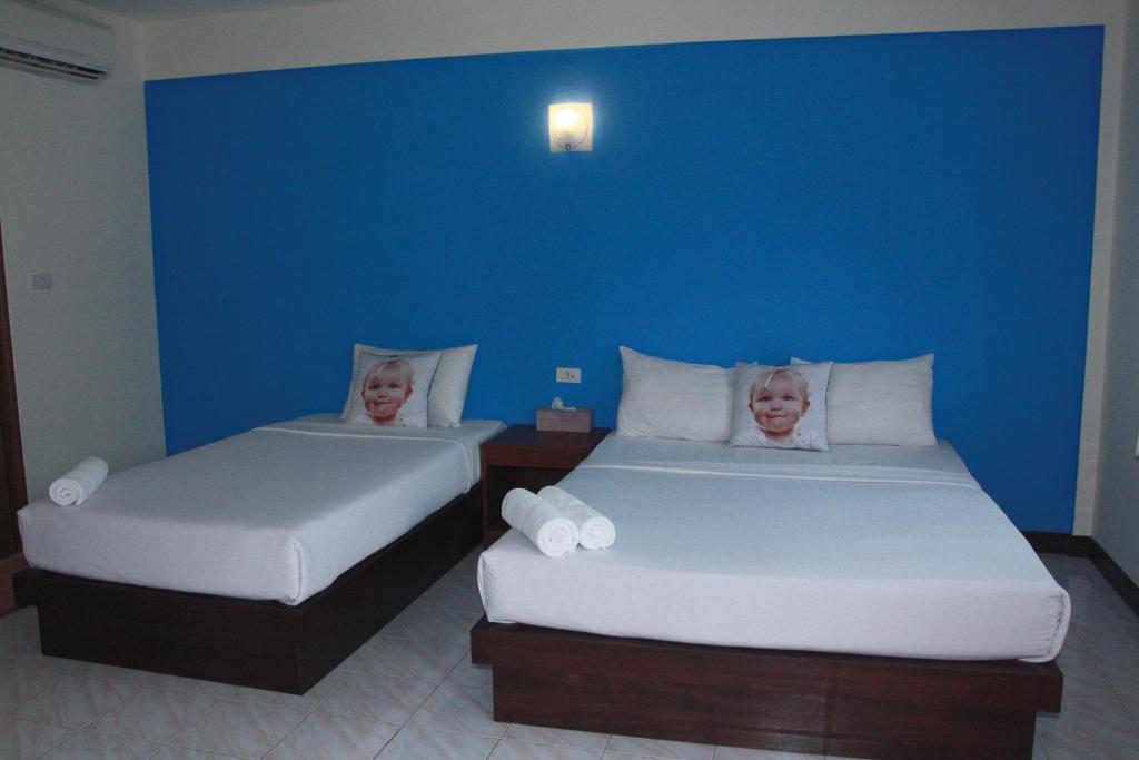 Postel nebo postele na pokoji v ubytování Forum House Hotel Krabi