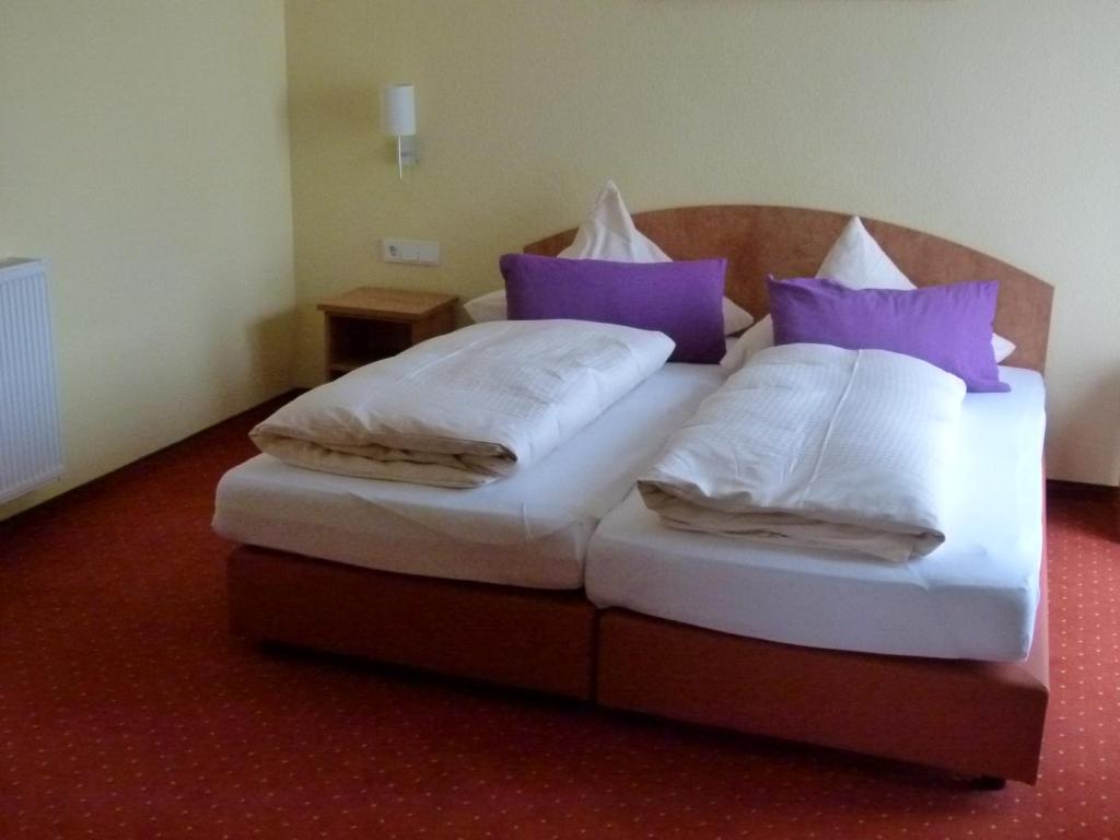 Postel nebo postele na pokoji v ubytování Hotel Holzhauer