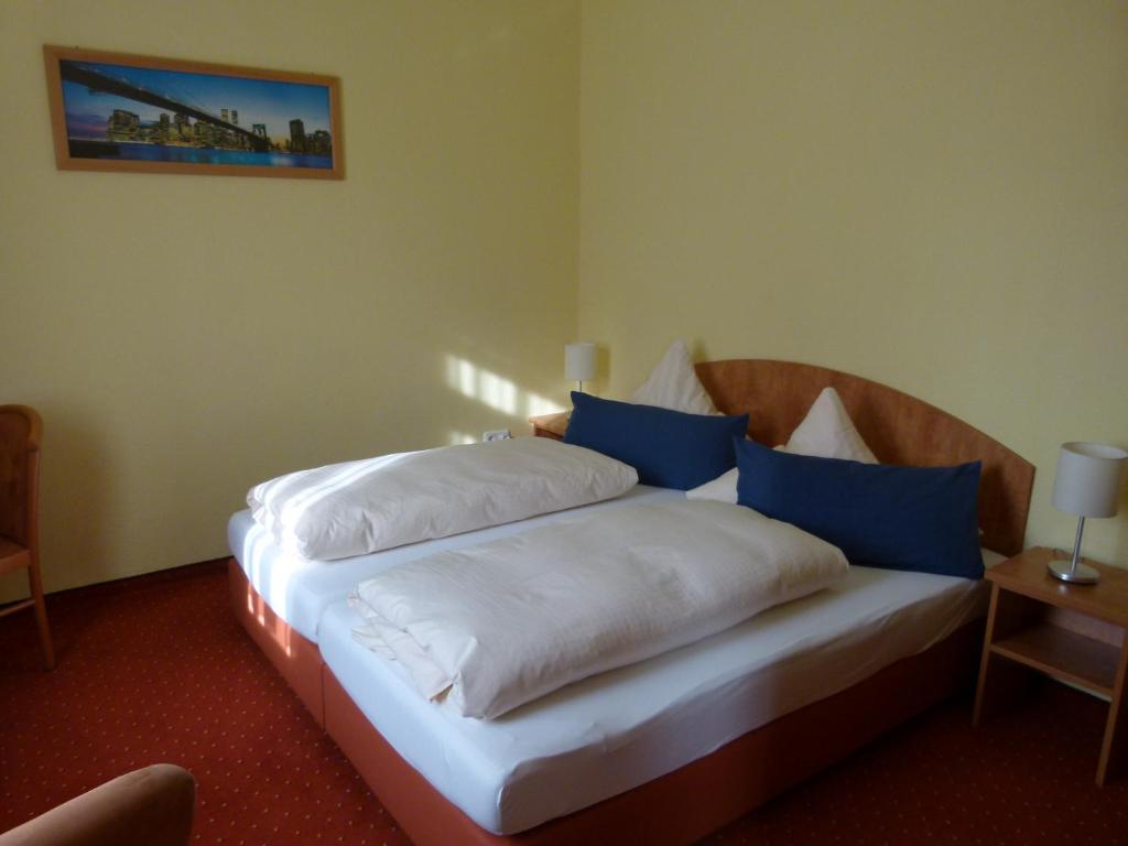 Postel nebo postele na pokoji v ubytování Hotel Holzhauer