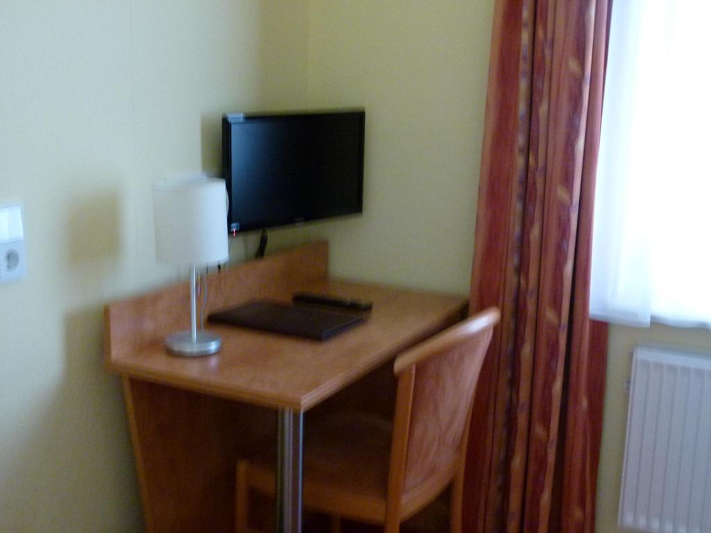 TV a/nebo společenská místnost v ubytování Hotel Holzhauer