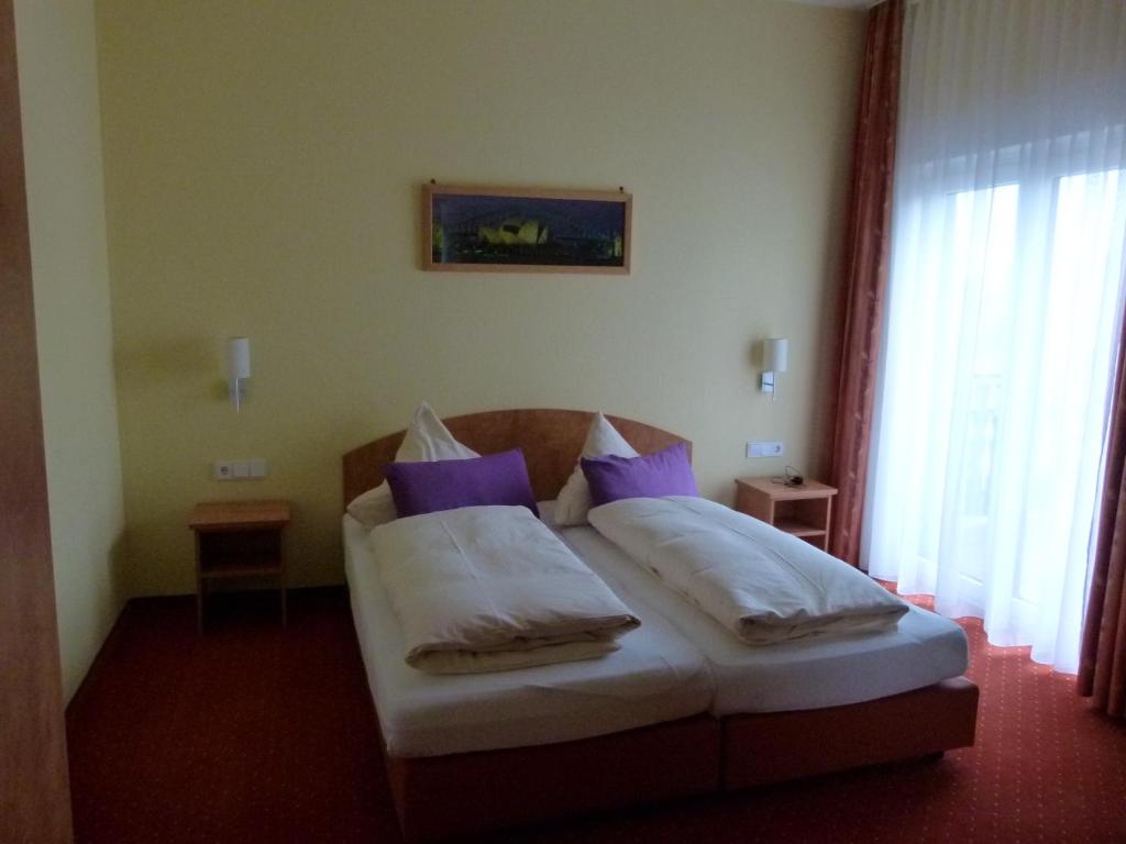 Postel nebo postele na pokoji v ubytování Hotel Holzhauer