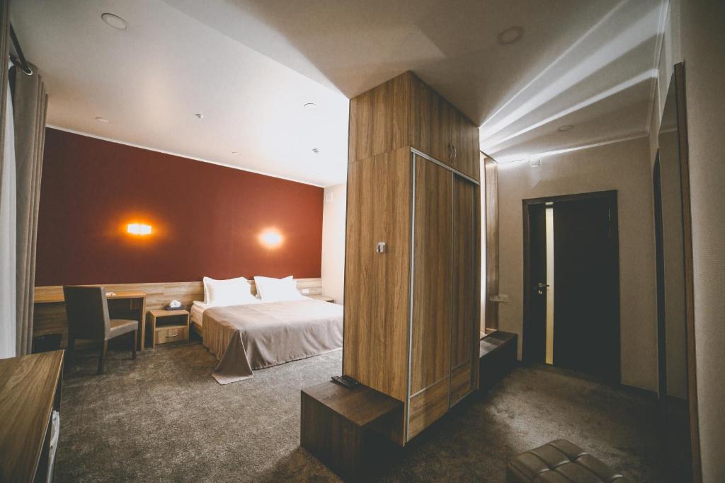 Postel nebo postele na pokoji v ubytování Lumarc Hotel