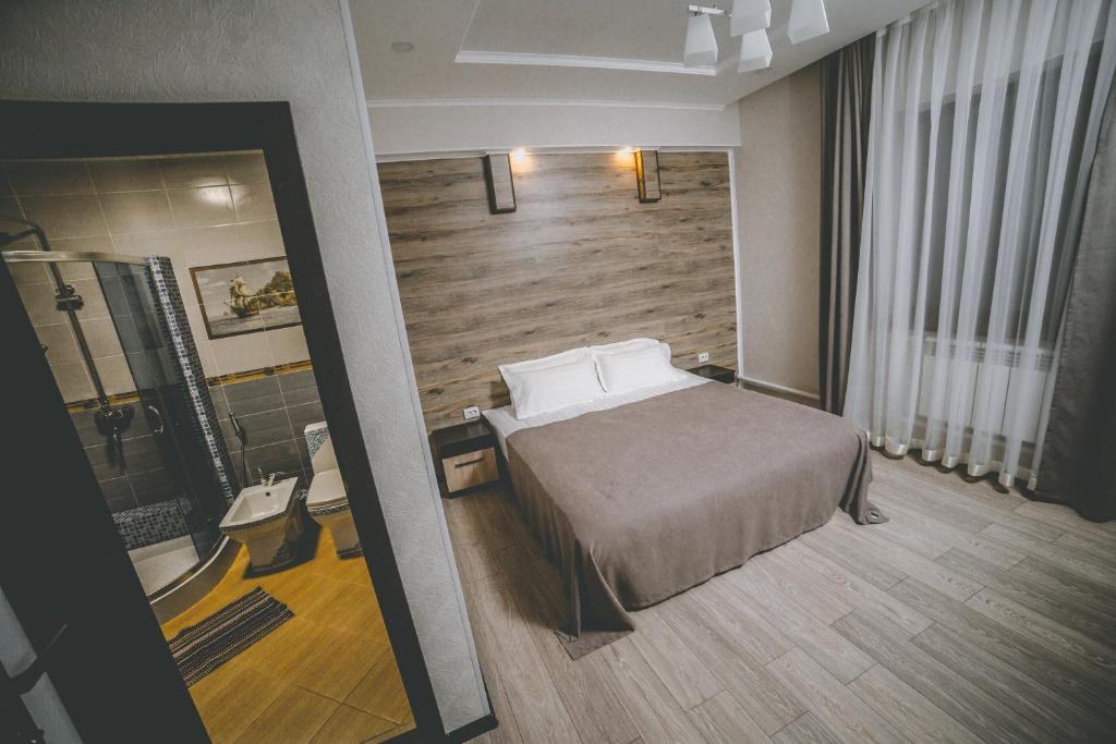 Postel nebo postele na pokoji v ubytování Lumarc Hotel