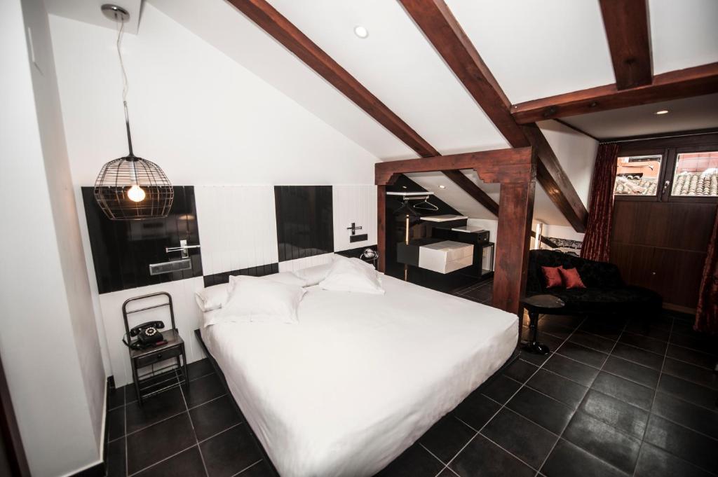Posada del León de Oro Boutique Hotelにあるベッド