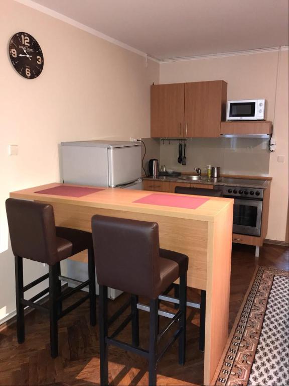 Kuchyň nebo kuchyňský kout v ubytování Five Apartments