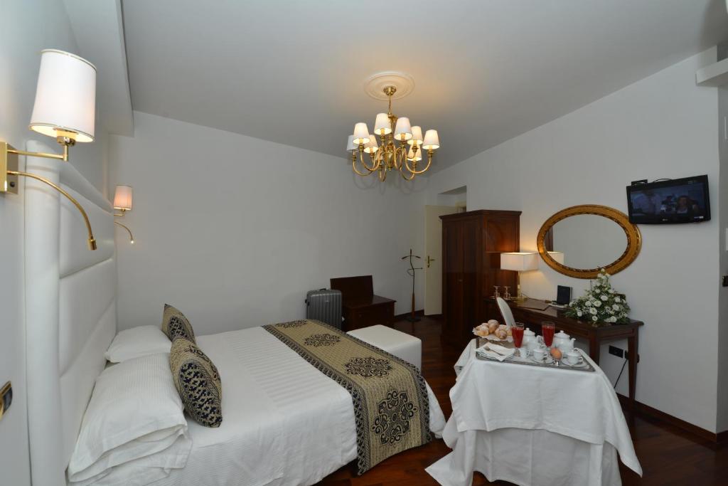 Postel nebo postele na pokoji v ubytování Hotel Palma