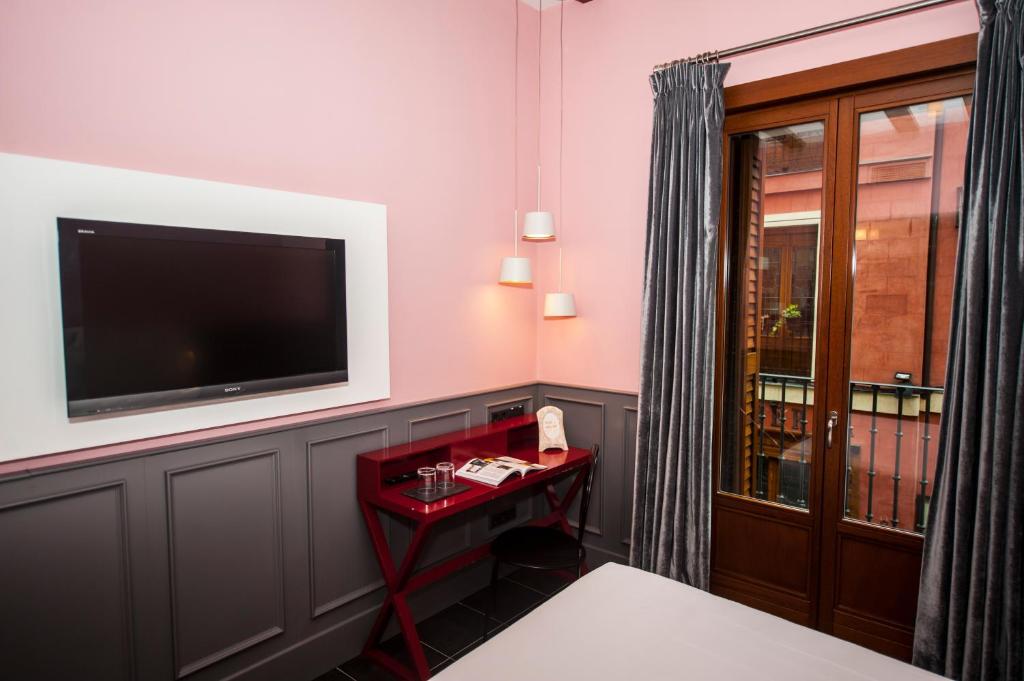 Posada del León de Oro Boutique Hotelにあるテレビまたはエンターテインメントセンター