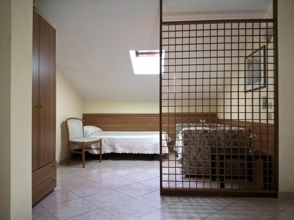 Postel nebo postele na pokoji v ubytování Hotel Rocco