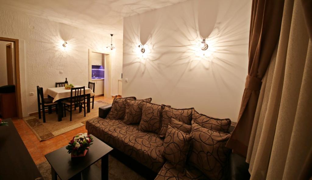 a living room with a couch and a table at Apartman Vanja in Bar