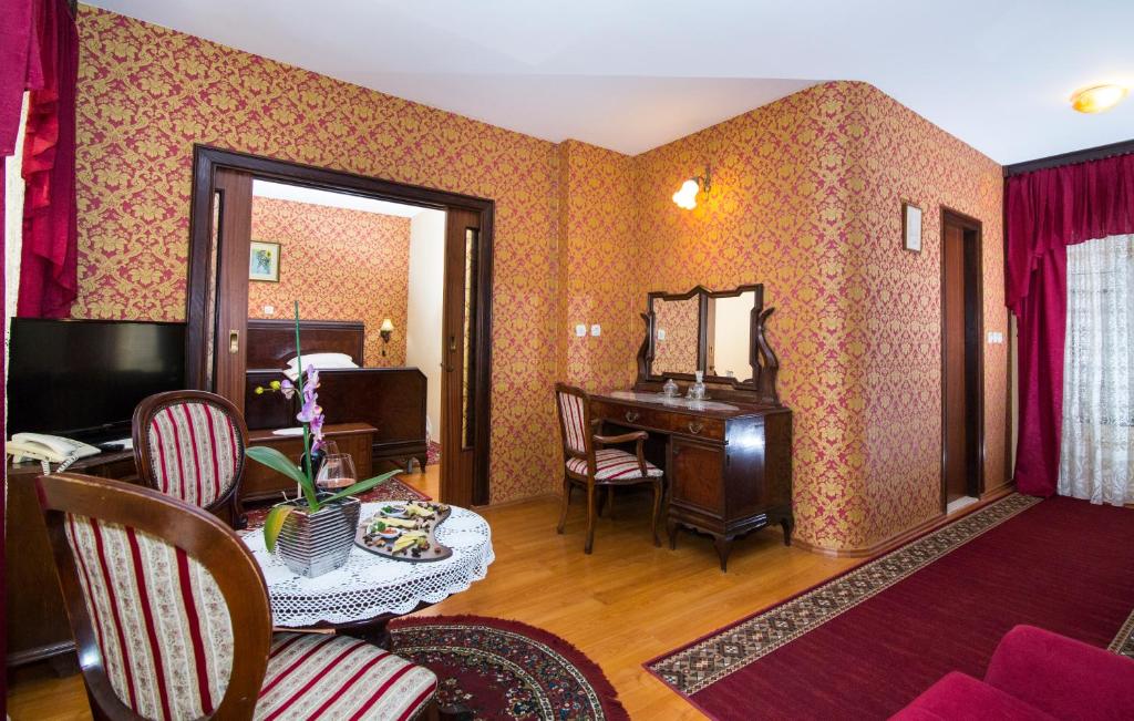 TV a/nebo společenská místnost v ubytování Heritage Hotel Pasike