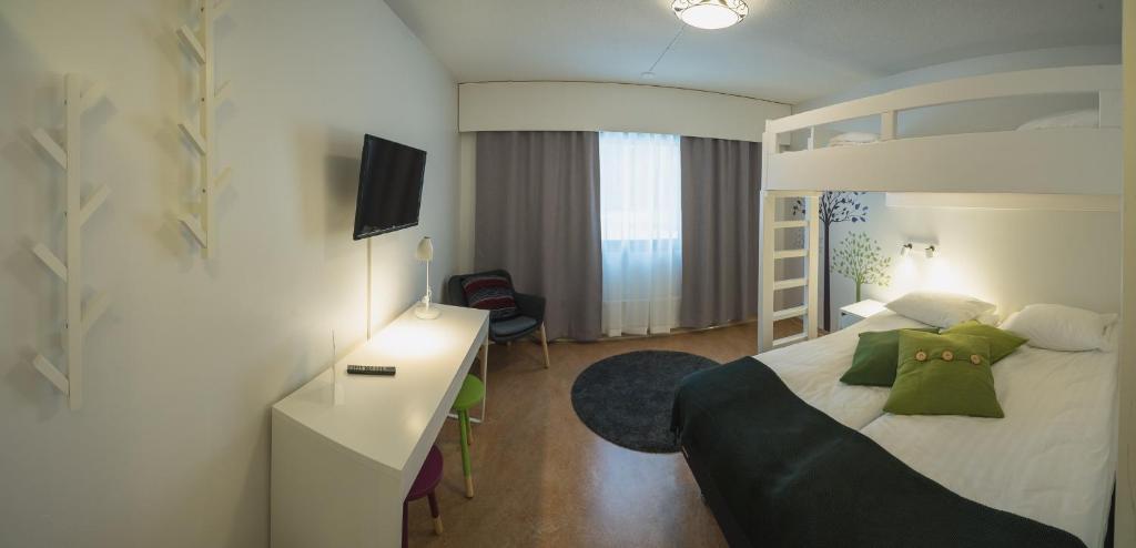 Postel nebo postele na pokoji v ubytování Hotel Kittilä