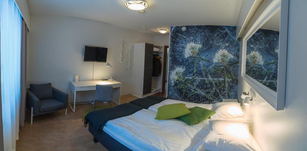 Postel nebo postele na pokoji v ubytování Hotel Kittilä