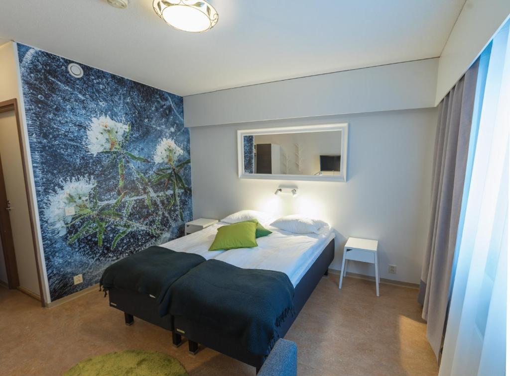 Postel nebo postele na pokoji v ubytování Hotel Kittilä