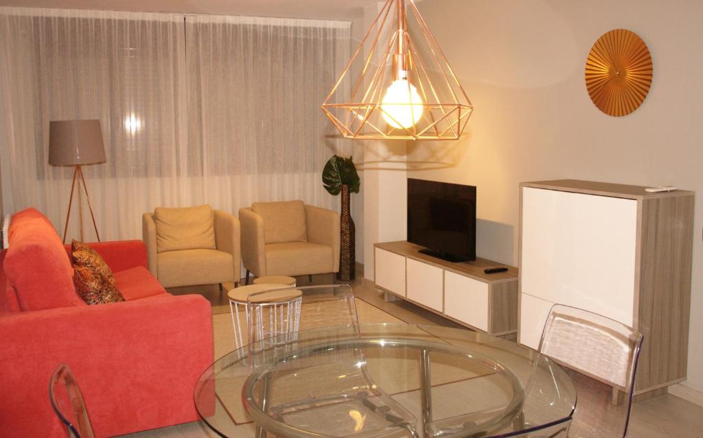 TV a/nebo společenská místnost v ubytování Apartamentos Real Lleida