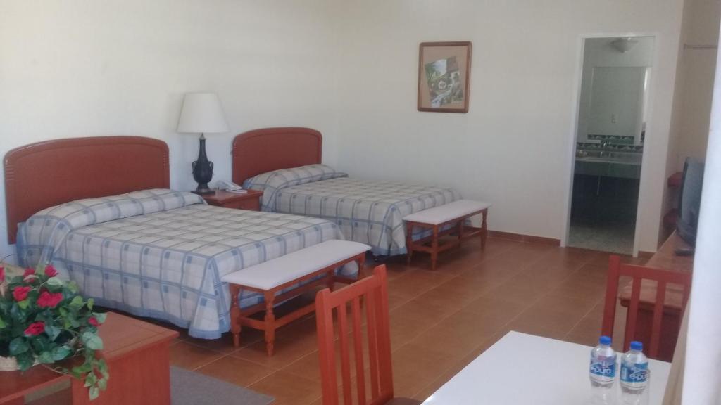 Postel nebo postele na pokoji v ubytování Villa Caltengo