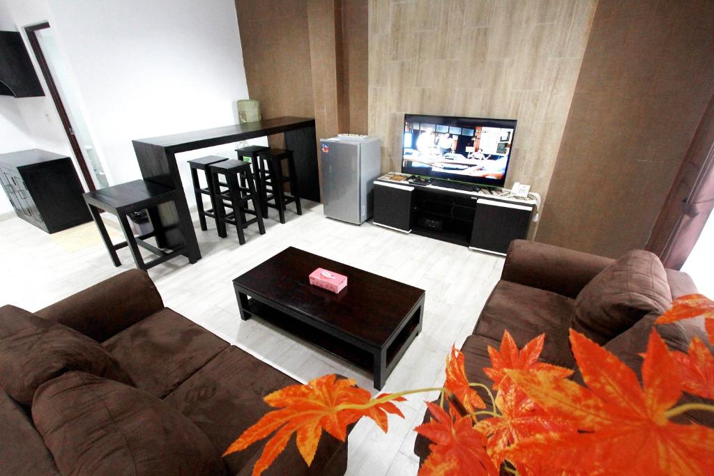 TV a/nebo společenská místnost v ubytování BeOne House Jogja