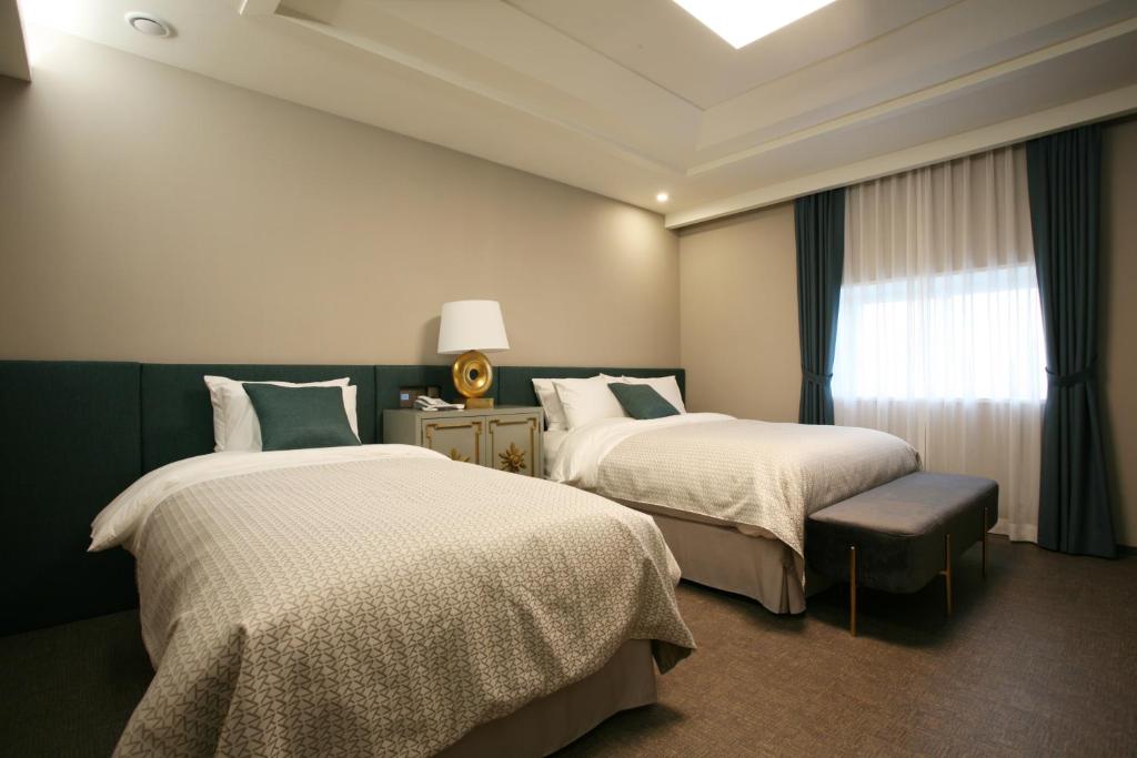 Postel nebo postele na pokoji v ubytování Polaris Hotel