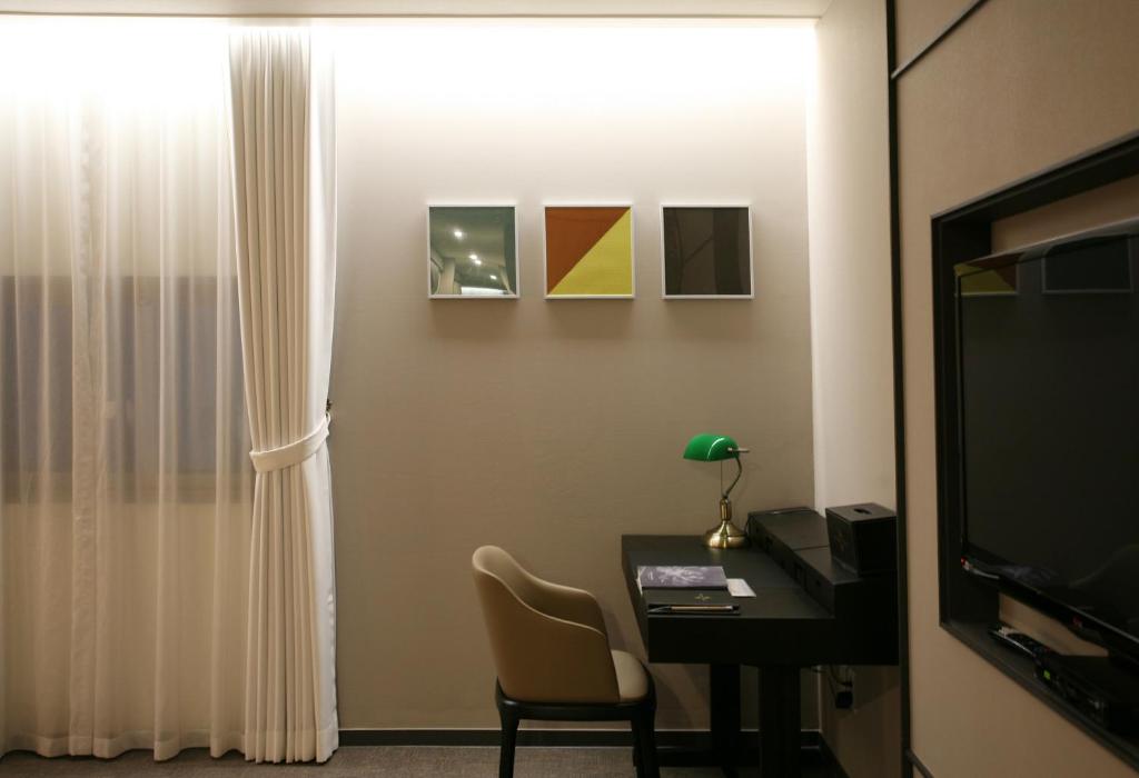 TV a/nebo společenská místnost v ubytování Polaris Hotel