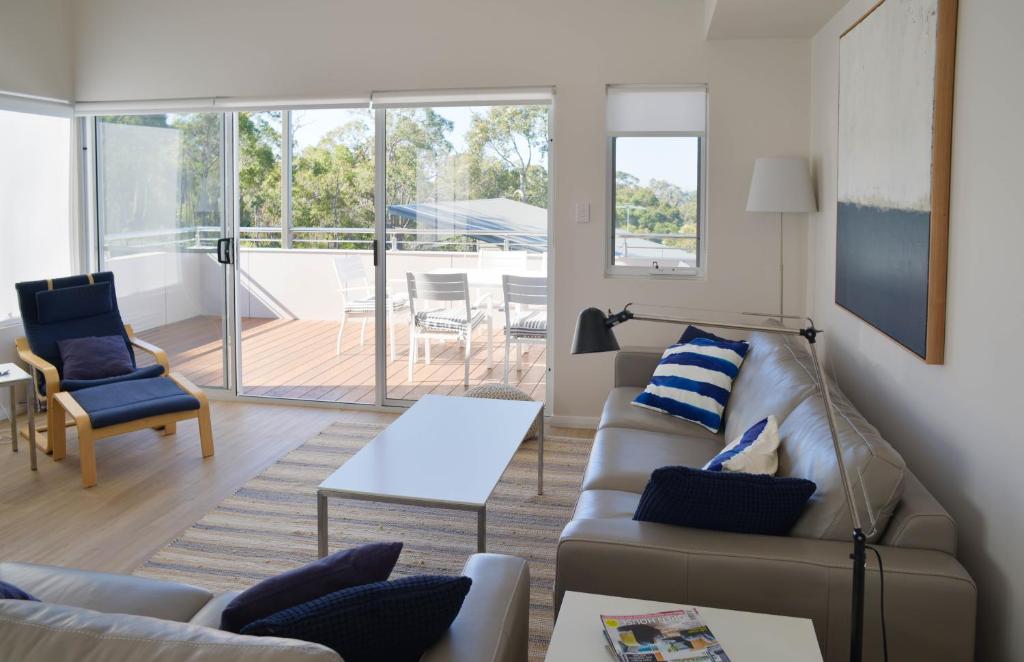 a living room with a couch and a table at The Villa Dunsborough in Dunsborough