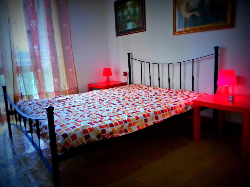 Łóżko lub łóżka w pokoju w obiekcie Villa Arancio Giorgio