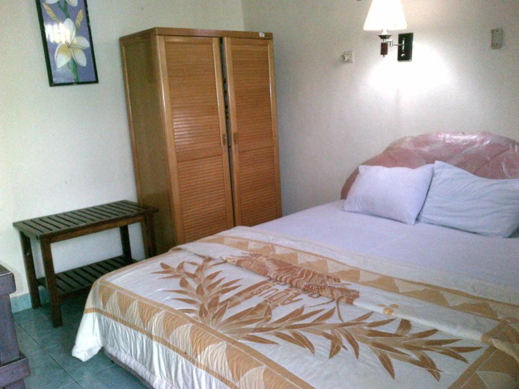 Postel nebo postele na pokoji v ubytování Adus Beach Inn