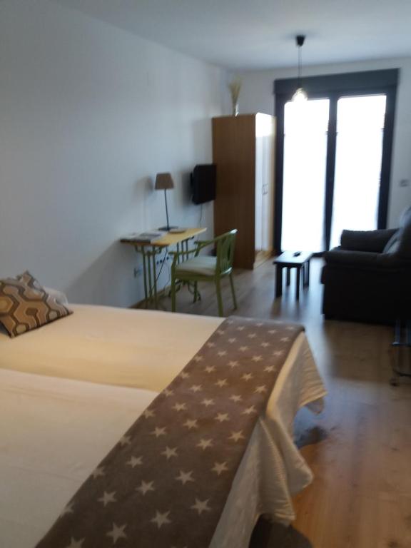 Cama o camas de una habitación en Apartamentos La Rocanda
