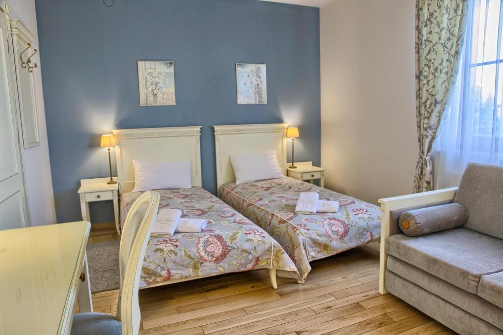 Un ou plusieurs lits dans un hébergement de l'établissement Villa Estera - Hotel & Restauracja