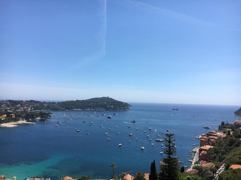 a view of a bay with boats in the water at Escape to the French Riviera in Villefranche-sur-Mer