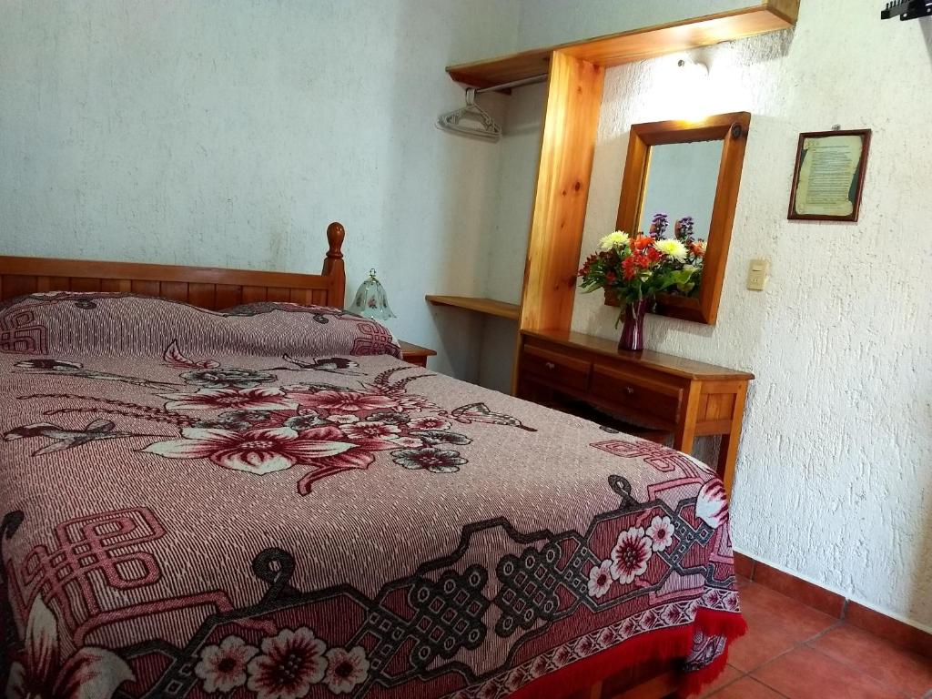 Postel nebo postele na pokoji v ubytování Posada Cuallicochi