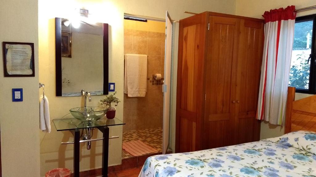 Postel nebo postele na pokoji v ubytování Posada Cuallicochi