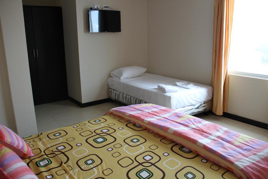 Postel nebo postele na pokoji v ubytování Fogata Hostel