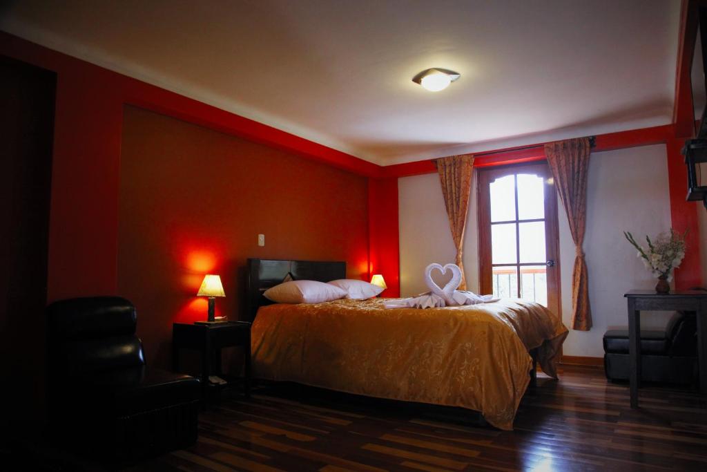 Postel nebo postele na pokoji v ubytování Tunupa Lodge Hotel