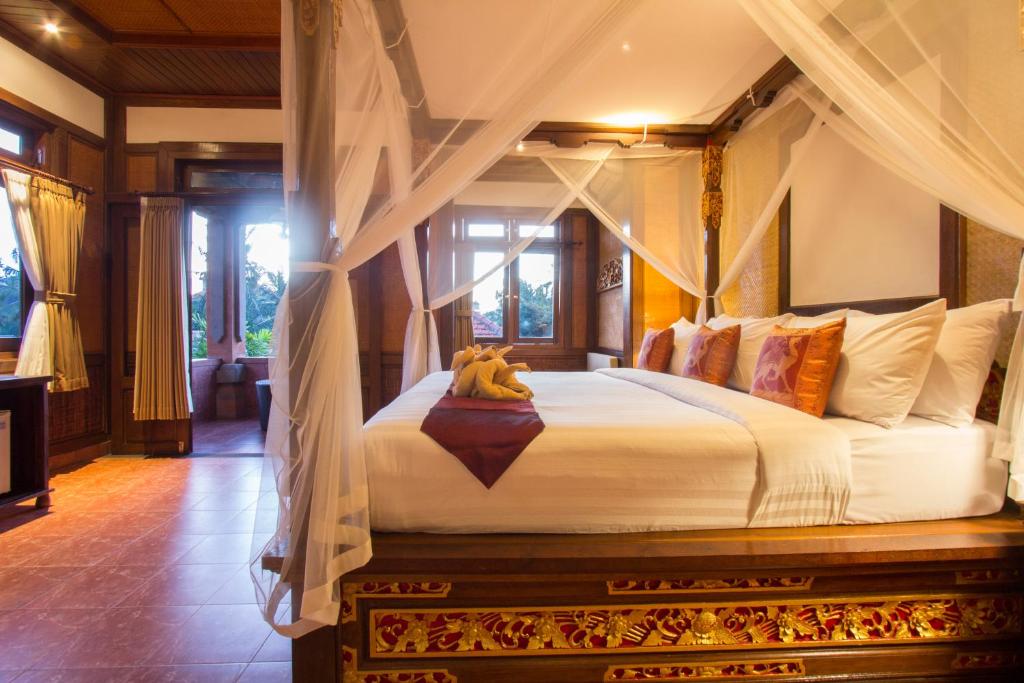 Postel nebo postele na pokoji v ubytování Ubud Terrace