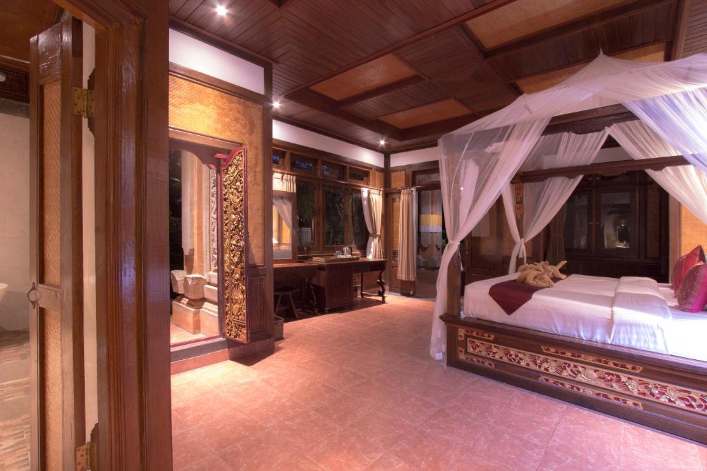 Postel nebo postele na pokoji v ubytování Ubud Terrace