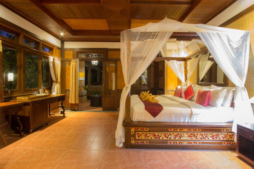 Postel nebo postele na pokoji v ubytování Ubud Terrace