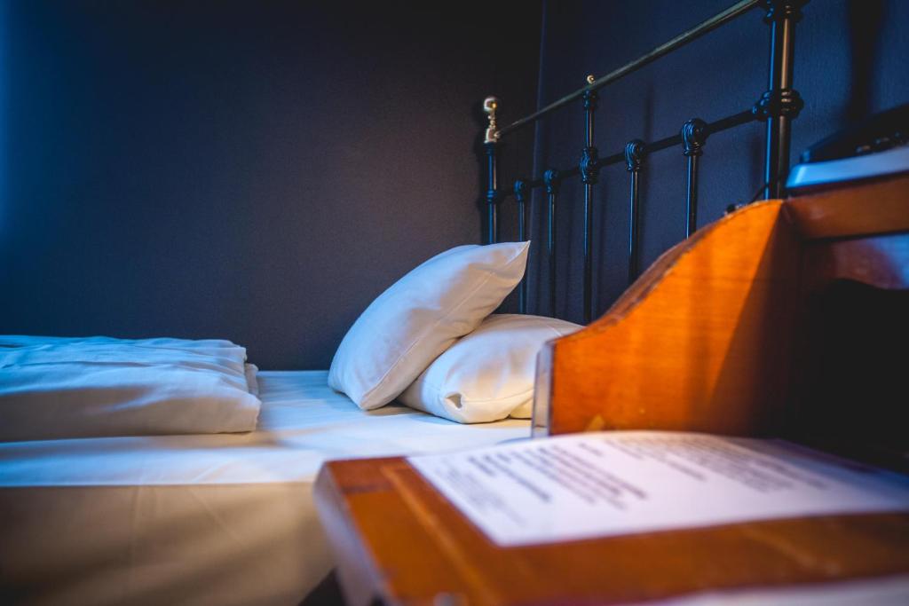 Postel nebo postele na pokoji v ubytování Hotel Alexander