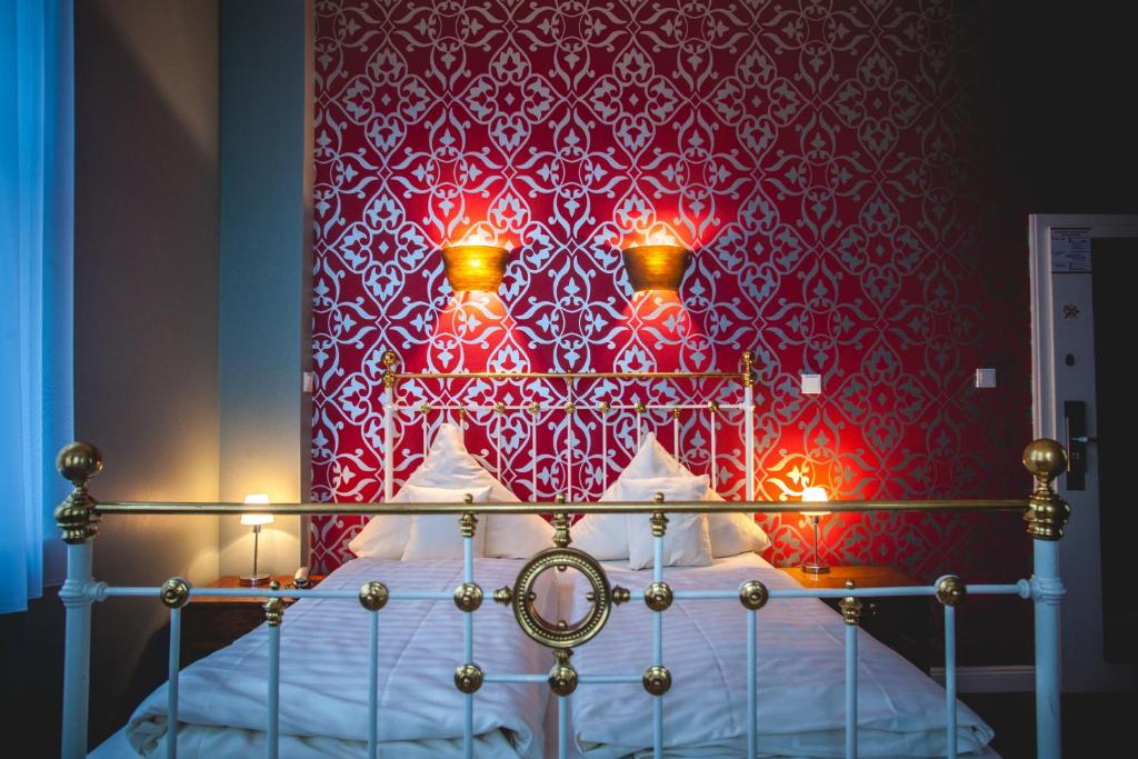 Postel nebo postele na pokoji v ubytování Hotel Alexander